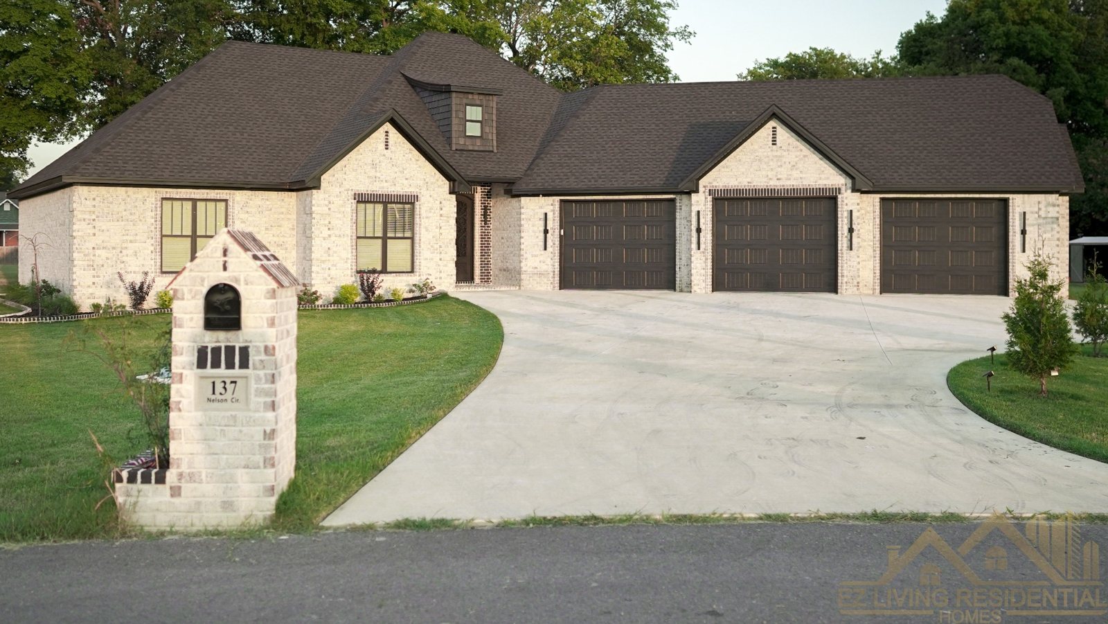 Nelson Circle completed brick home with three-car garage